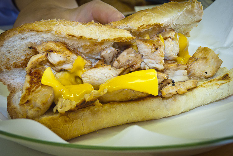 Grace serves up a freshly grilled chicken breast sandwich with goo-rrific American cheese.